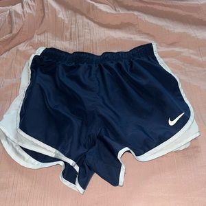 Navy and white Nike shorts.